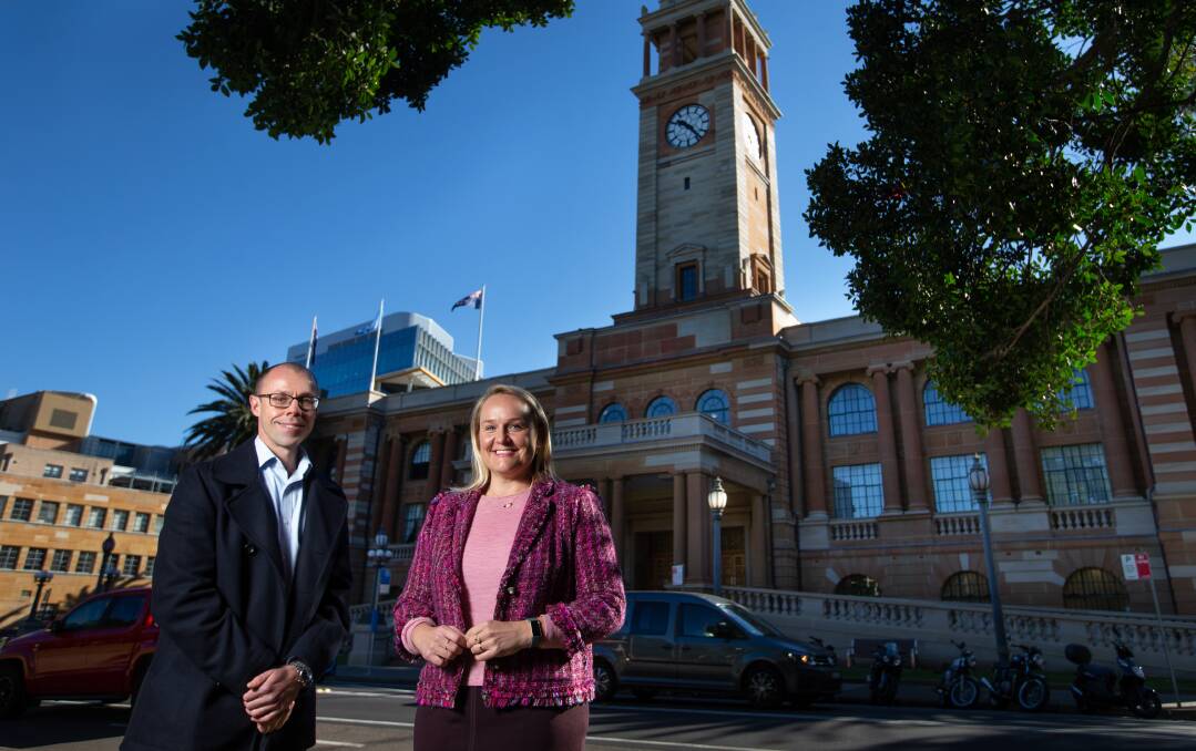 FINISHED: City of Newcastle project manager Matthew Bennett and Newcastle Lord Mayor Nuatali Nelmes outside the newly refurbished Newcastle City Hall. Picture: Marina Neil