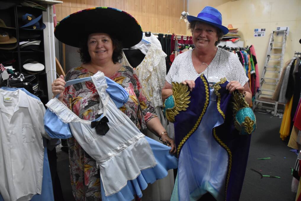 FANCY DRESS: Alice's Wonderland co-owners and sisters Wendy Dare and Roslynn Wooding on their final day in their Adamstown store.