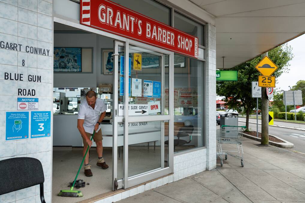 SUBURB STAPLE: Grant Conway has been working from this Jesmond barber for nearly 40 years. Pictures: Max Mason-Hubers