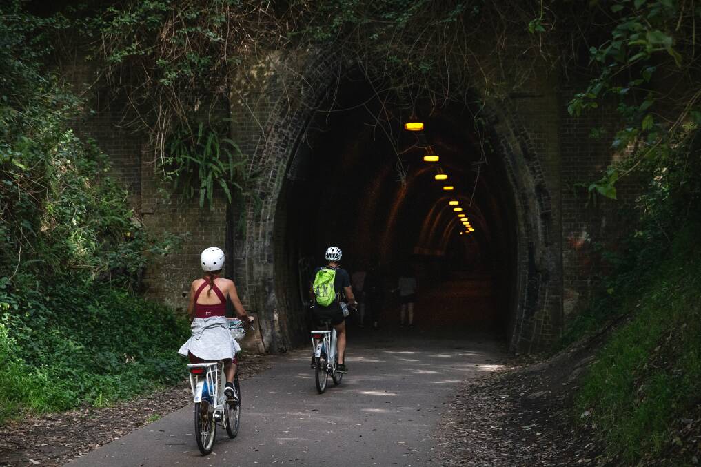 PICTURESQUE: Cyclists enter the Fernleigh tunnel between Kahibah and Adamstown Heights. 