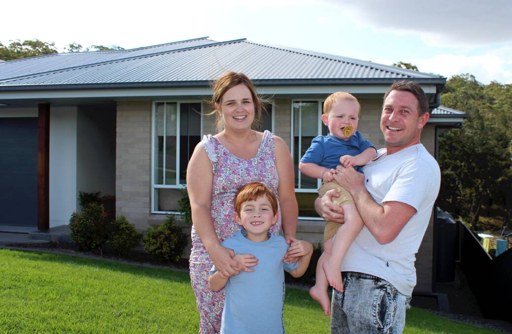 SETTLING IN: Cameron Park's Hayley and Jarrod Gibson with sons Teddy, 6, and Rafferty, 2. Picture: Hamish Geale 