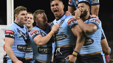 Daniel Saifiti at his barnstorming best, scoring a try for NSW in the 2021 Origin series. Picture Getty Images