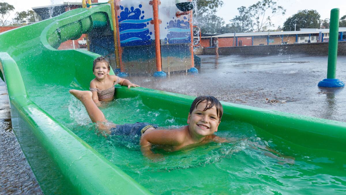 Siblings Marley, 3, and Kai, 4, cooled off at Lambton Pool on Tuesday after another scorching day in Newcastle. Picture by Max Mason-Hubers