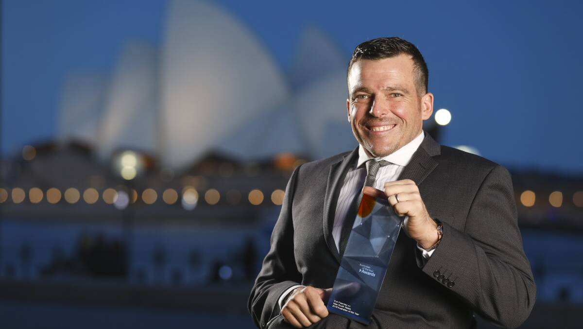 CHAMPION: Kurt Fearnley with his NSW Australian of the Year award in Sydney on Monday night. Picture: Salty Dingo