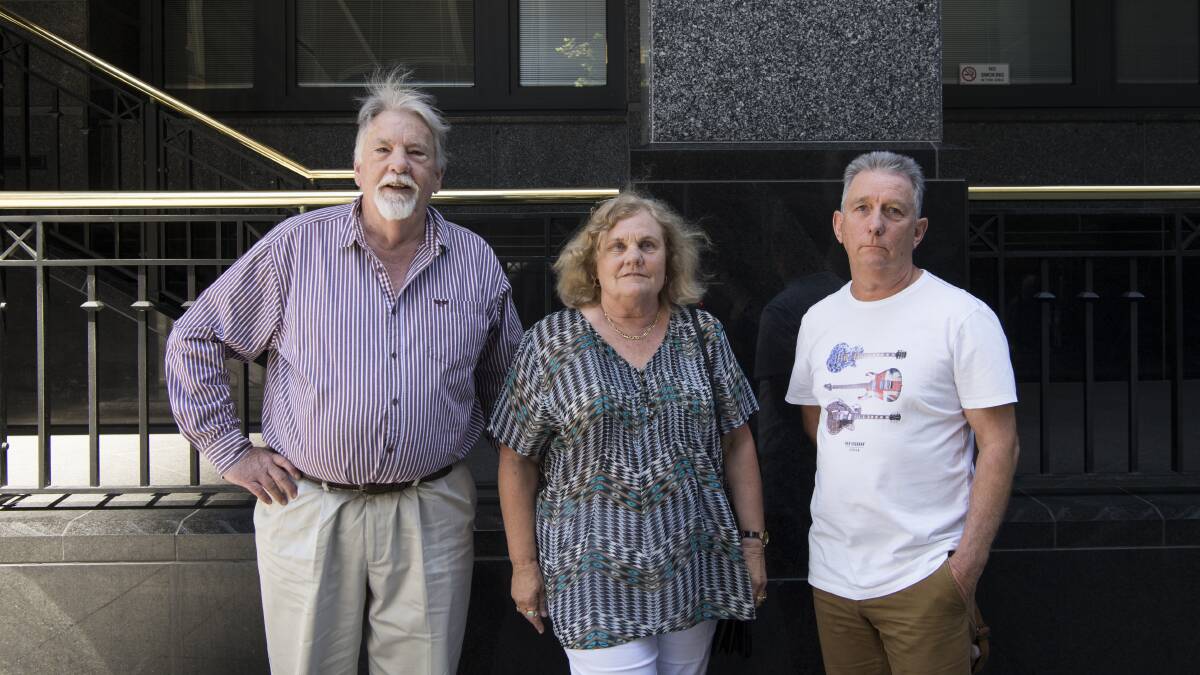 SEARCHING FOR ANSWERS: Murray Cassie with Carol McKinstry and Richard Galloway, who lost money to Ray Walker, outside court on Wednesday. Picture: Louise Kennerley