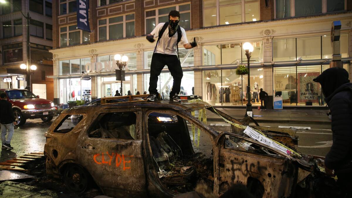 CHAOS: A protester in Seattle as riots spread across the United States. Picture: Getty Images