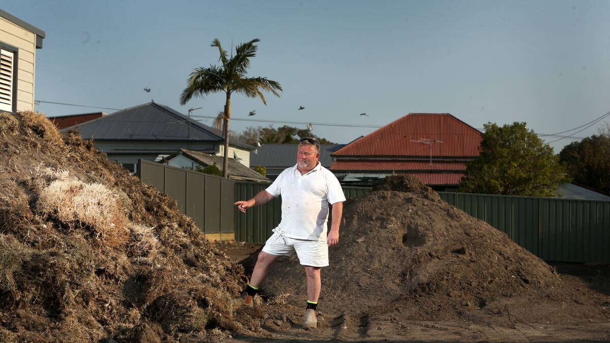 FED UP: Mark Hambier is stuck with tonnes of disturbed lead-laden dirt and grass in the yard of his Fifth Street, Boolaroo, property after authorities refused to accept it at the tip. Picture: Marina Neil 