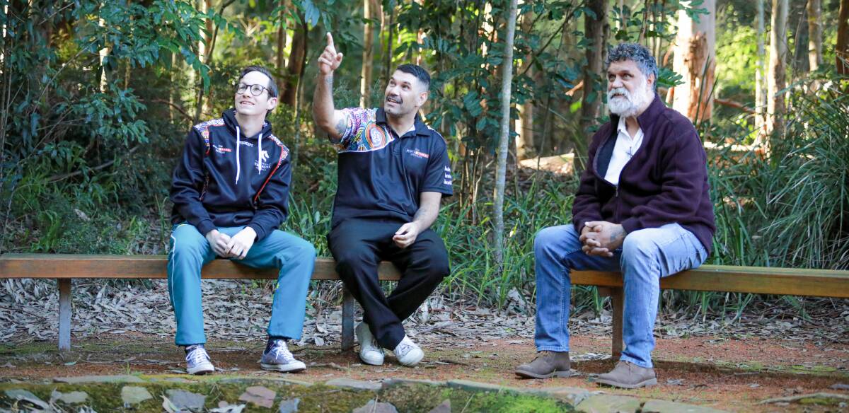 WORDS MATTER: Dr Raymond Kelly, right, says language gives Indigenous people a sense of identity, connection and belonging. Dr Kelly is pictured with first year medical student David Parsons, left, and Wollotuka Institute project officer Kua Swan, centre.