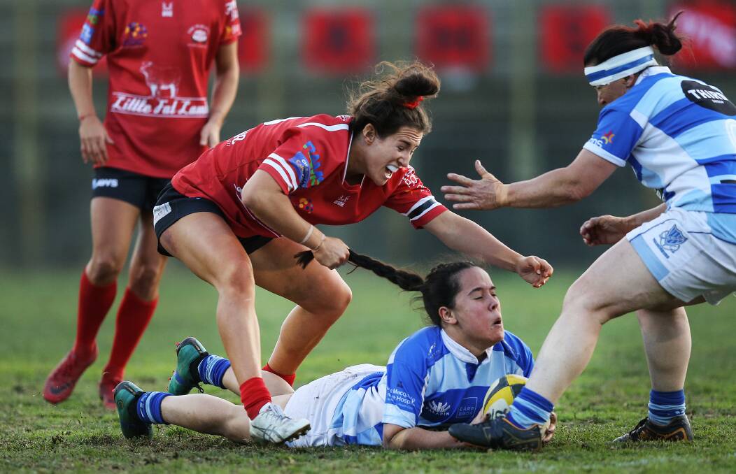 FINALIST: Maya Stewart of the Waratahs tries to steal the ball from the Wanderers' Tayla Sampson during the 2018 women's rugby union grand final. Picture: MARINA NEIL