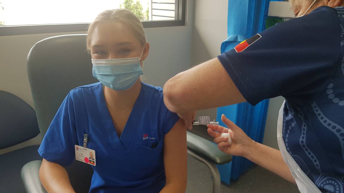 VACCINATED: Belmont hospital's Angel St John was the first Hunter healthcare worker to be vaccinated against COVID-19 after she was chosen to travel to Sydney.