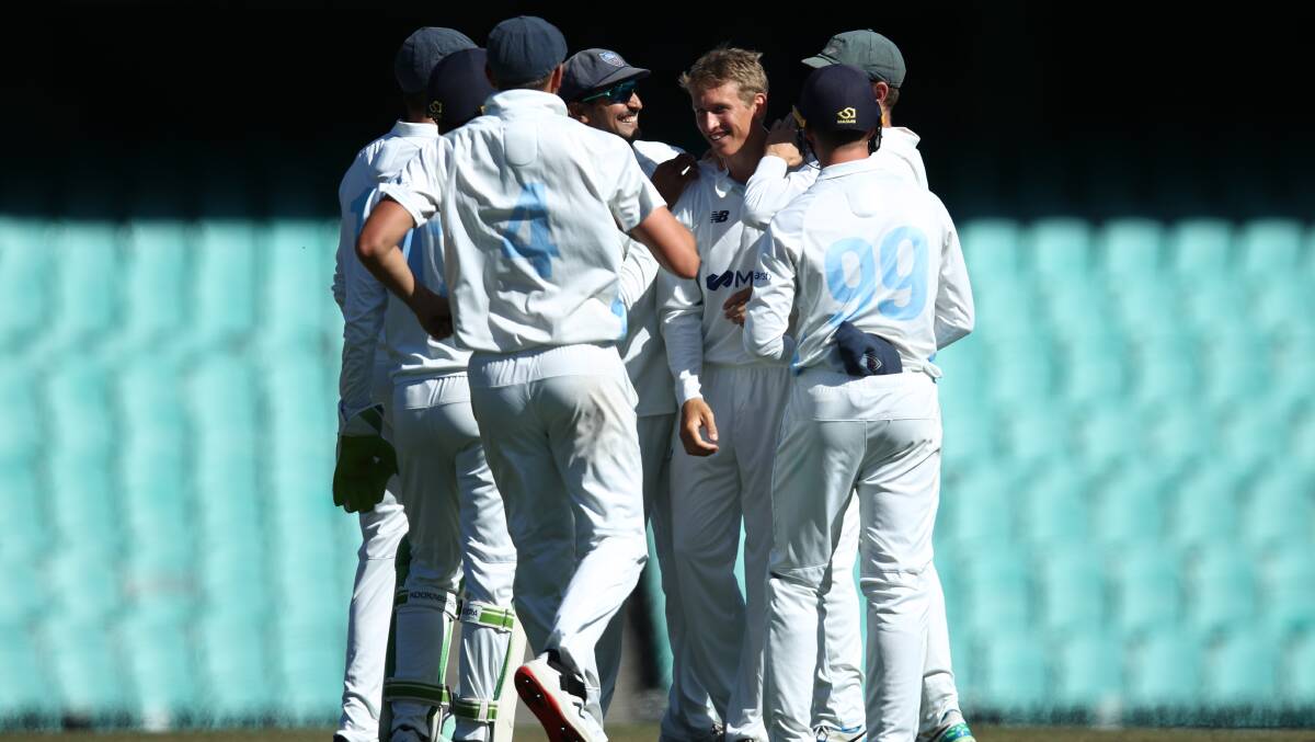 The Blues celebrate after Toby Gray takes one of his three wickets on debut. Picture by Getty