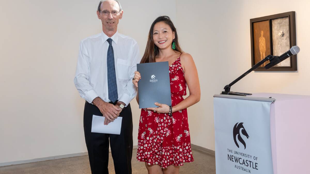 Courageous: Jennifer Tan with Associate Professor Miles Bore, who retired in 2019, at a school prize ceremony. 