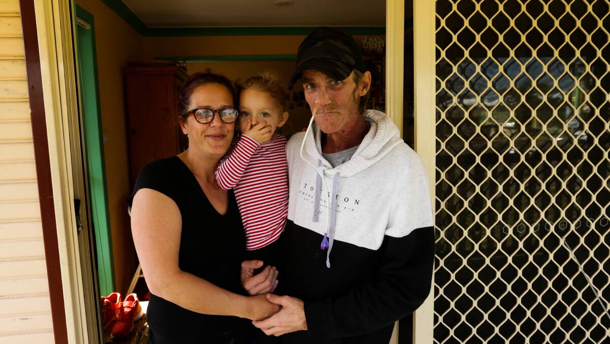 Rohen Andrews with his partner Rebecca Wallis, left, and daughter Harper, centre. Picture: Jonathan Carroll