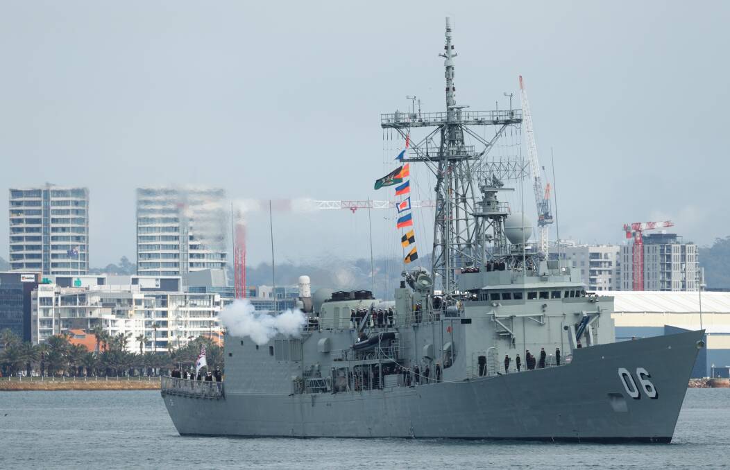 DEPARTURE: HMAS Newcastle sails out of the port of its namesake city, the final time before it is decommissioned on June 30. Picture: Max Mason-Hubers 