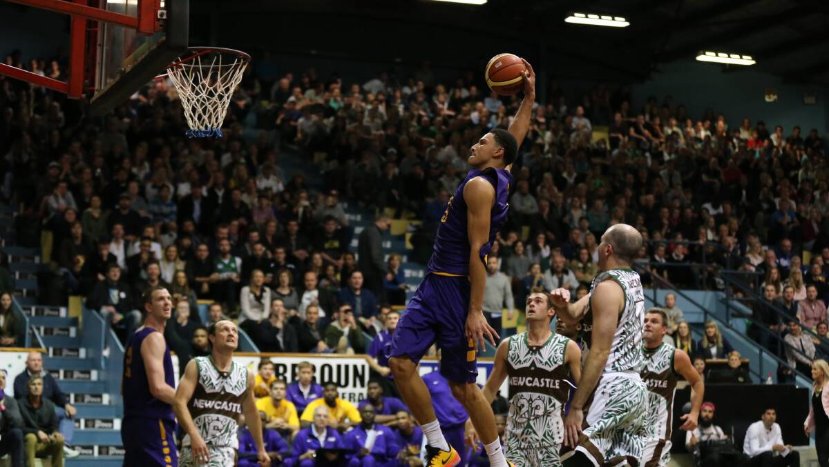 STAR POWER: Newcastle's Ben Simmons about to dunk while playing here for Louisiana State University against a Newcastle invitational team in 2015. Picture: Sproule Sports Focus