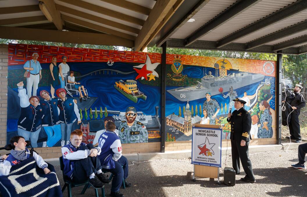 WORK OF ART: HMAS Newcastle's commanding officer, Commander Anita Sellick, at the unveiling of the new mural at Newcastle Senior School in Waratah. Picture: Max Mason-Hubers