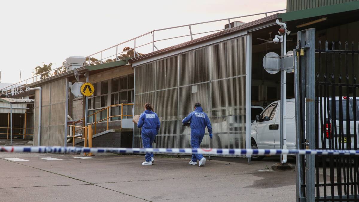 Police at the former chicken factory in Cardiff where police say Mr Dilosa had been residing. Picture: Marina Neil