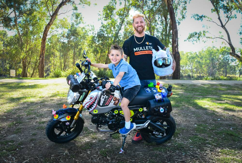 Rhys Chan and five-year-old son Lucas Chan are raising funds and awareness for mental health. Picture by Bernard Humphreys 