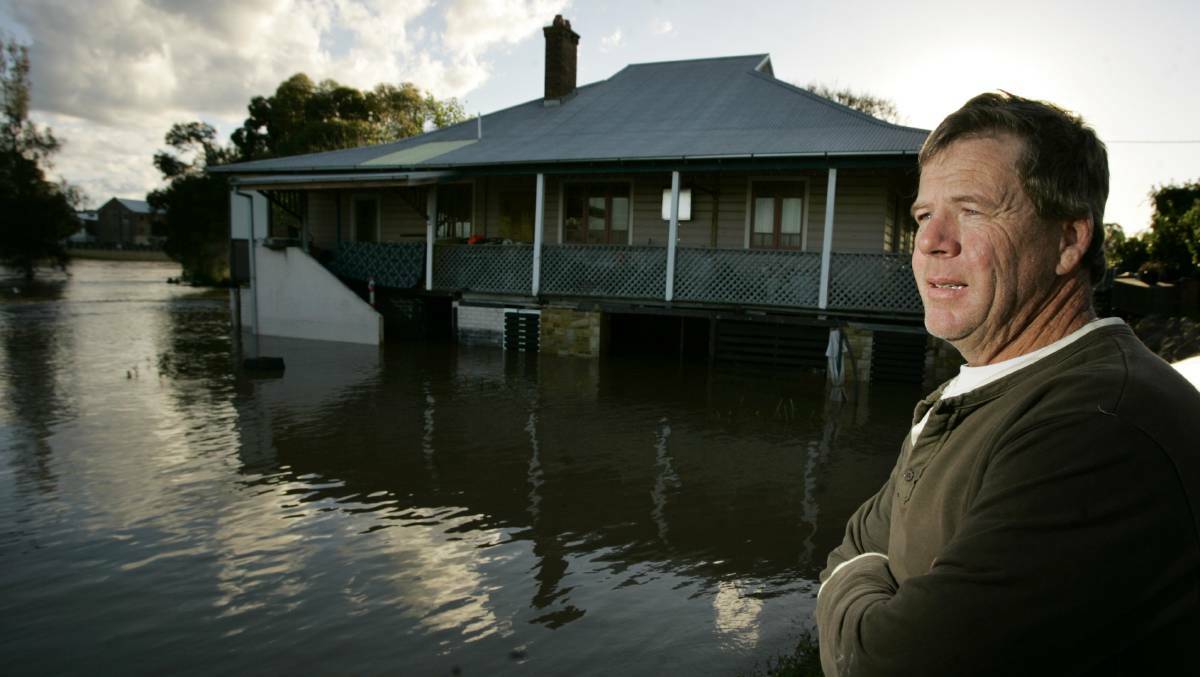 HIGH TIDE: Chris Marsh at his Lorn home during a previous flood. PICTURE: Peter Stoop.