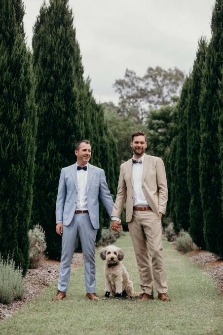 JUST IN TIME: Xavier Huitorel, Bastian Storch and their dog Banjo in the Hunter Valley last week. It was one of the region's first same-sex marriages, after the couple was exempt from the waiting period. Picture: Cloud Catcher Studio 