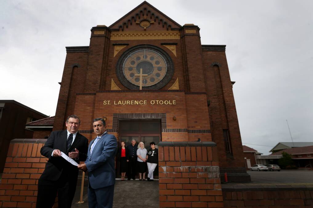 UP IN ARMS: Hunter Multicultural Communities president Bob Bell with Italian Welfare Organisation President Andrea Rufo and welfare representatives outside the St Laurence O'Toole church in Broadmeadow. Picture: Marina Neil 