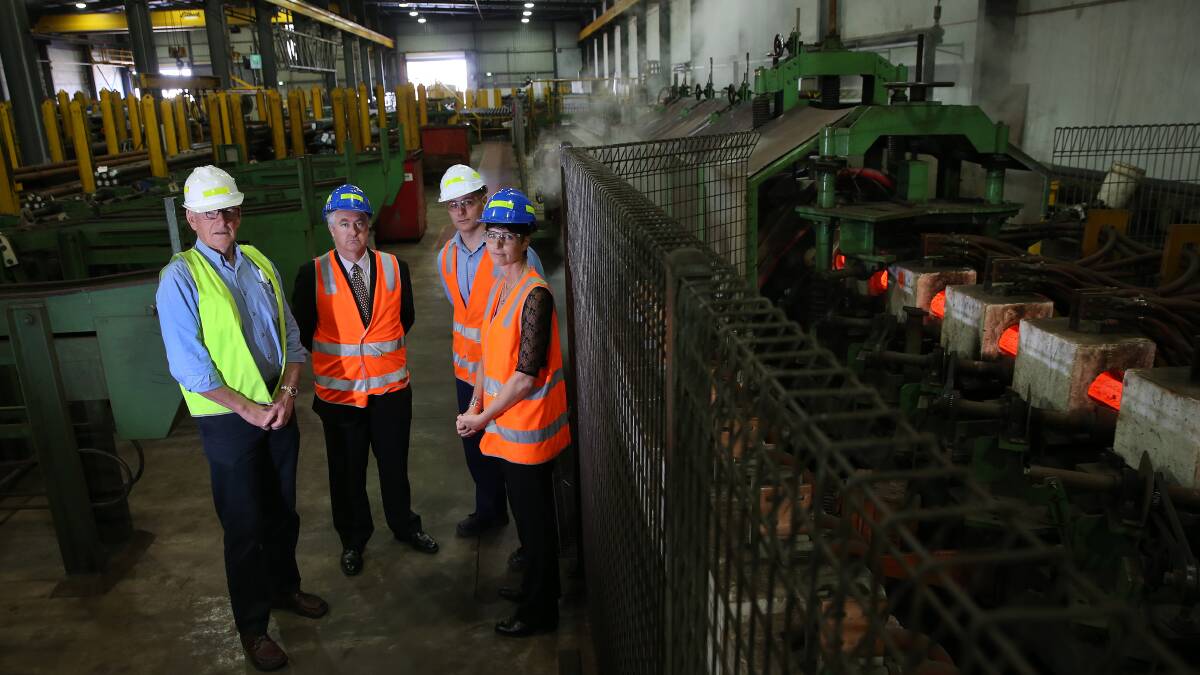 CONCERN: Milltech's Fred Reis, Shadow Energy Minister Adam Searle, employee Dean Taylor and local MP Kate Washington. Picture: Marina Neil