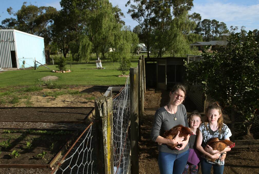 DISTURBING FIND: Connie Grant with her daughters Emma and Amy at their home in Salt Ash. Toxic chemicals have now been found at low levels in their bore water, even though it originally returned a non-detect. Picture: Marina Neil 