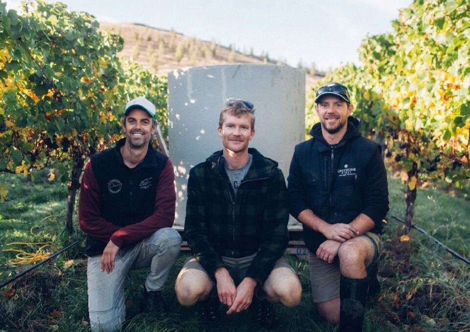TOP PRODUCERS: Greystone winemaker Dominic Maxwell, assistant winemaker Gavin Tait and cellar master Matt Corbett in front of a fermenter installed on the New Zealand South Island vineyard.