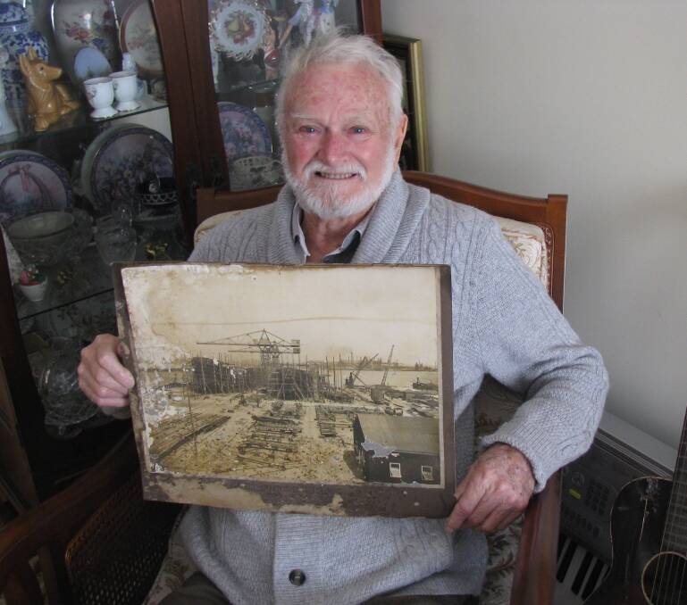 Memories: Duan Phillips with his rare photograph of the shipbuilding slips on Walsh Island (1914-1933). Picture: Mike Scanlon
