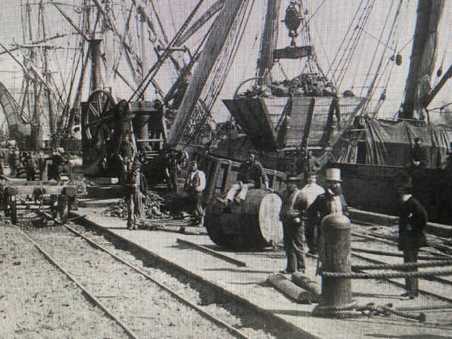 Coal being loaded onto ships at Queens Wharf in 1866 on today's foreshore near the pilot station.
