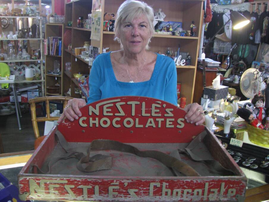 SWEET: Regent stallholder Julieanne Bright with a tray carried by lolly boys.