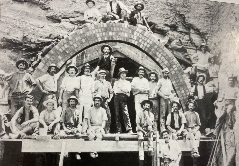 Workers brick-lining a Richmond Vale Railway tunnel pose besides a portal in late 1904. Picture - Brian R. Andrews Collection