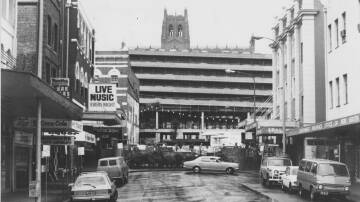 This rare 1980 photo looking up Market Street towards the Hunter Street Mall reveals the King Street car park after the Strand Theatre was demolished. Picture: John Herrett 