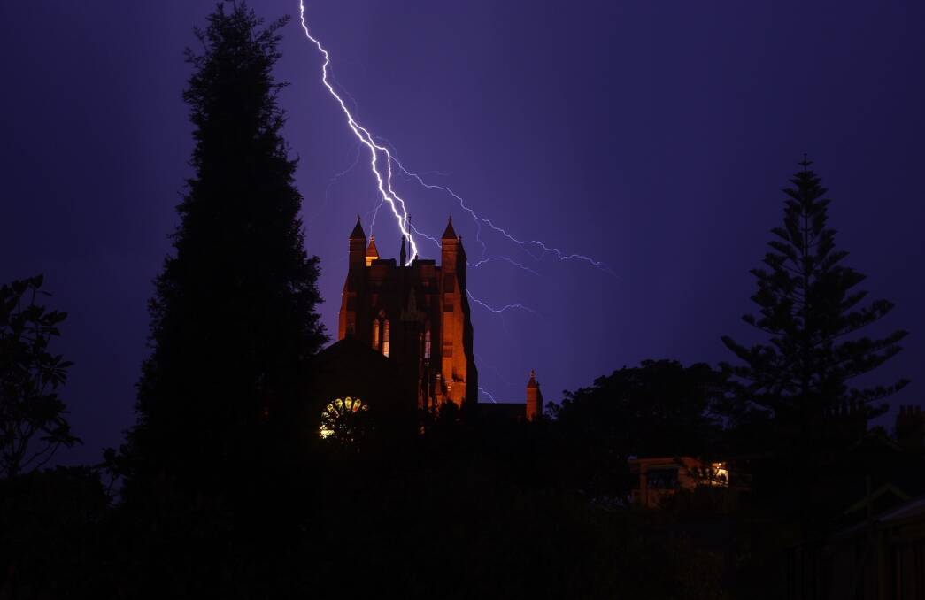Thunderstruck: In a fierce display of nature's raw power, a lightning bolt strikes Newcastle Cathedral. Picture: David Scanlon