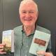 Secret history: Leslie Kilmartin with his books about the pioneering Cromartys of Port Stephens. Pictures: Mike Scanlon