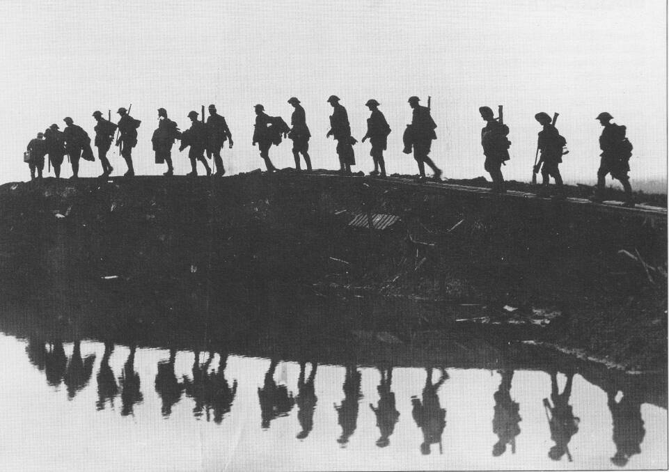 Lest we forget: World War I Diggers file in ghostly silhouette. Photos: Australian War Memorial