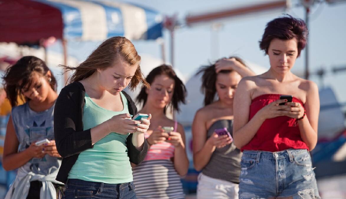 HIT WITH ALL AGES: It's not just teenagers who are glued to their mobile phones. 