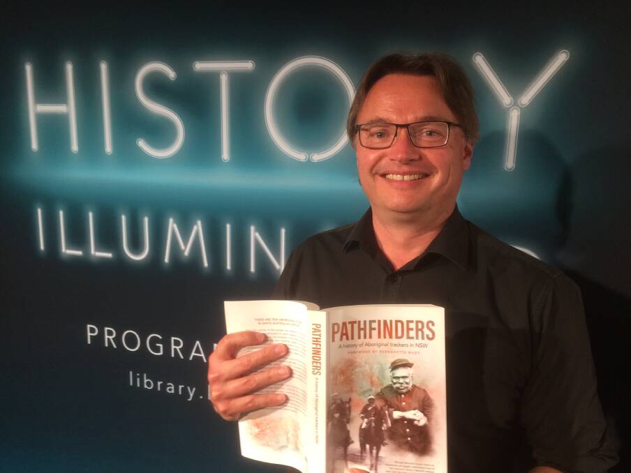 REVEALED: Michael Bennett with his book Pathfinders A history of Aboriginal trackers in NSW. Picture: Mike Scanlon