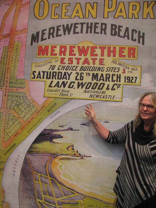 HAND-DRAWN: Local history librarian Alison Soo with a rare and colourful 1927 land sale plan of Merewether. Picture: Mike Scanlon