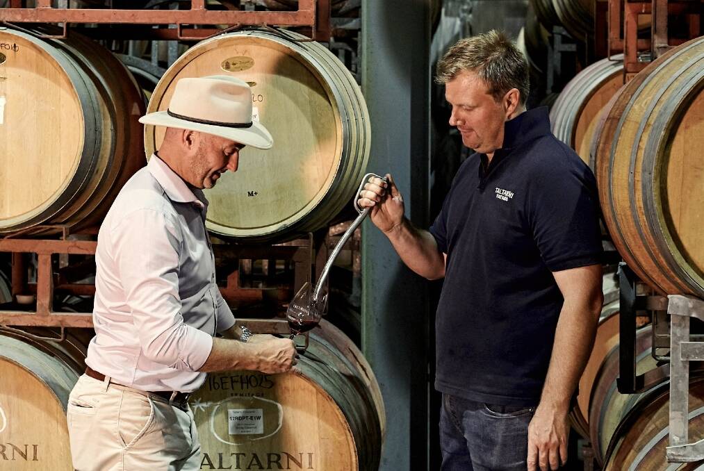 QUALITY: Chief winemaker Robert Heywood (right) and CEO Adam Torpy check a barrel sample in the Taltarni winery.
