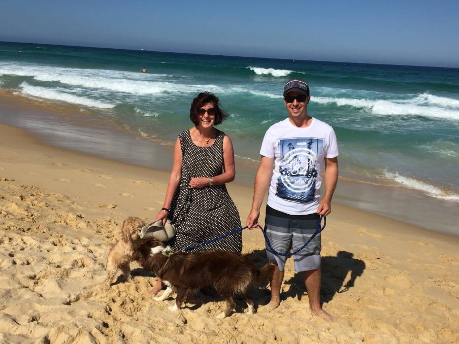 SOCIALISING AT REDHEAD: Mayor Kay Fraser and her lovable pooch, Archie, make friends at the beach.
 