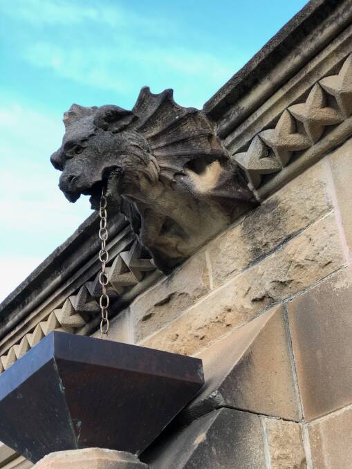 Rich detail: One of the building's many sandstone gargoyles.