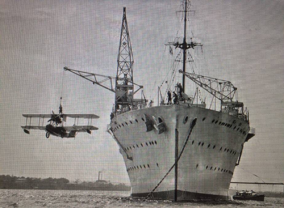 PROUD NAME: A Seagull III amphibian is lifted over the side of HMAS Albatross, possibly in 1929.