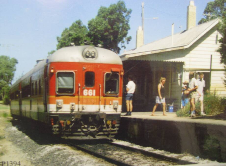 BUSY: A red railcar waits at Toronto station to leave for Fassifern in 1990. 