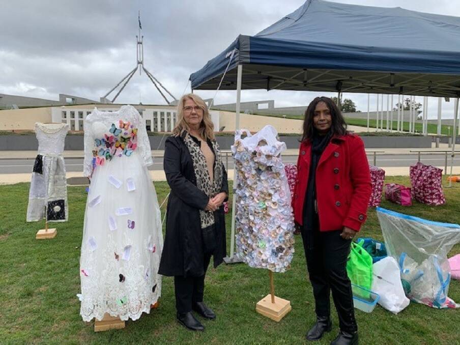 IMPOSSIBLE TO IGNORE: Pam Mackaway and Rosemary Pillay of Jenny's Place at Parliament House with the Dresses of Sorrow.
