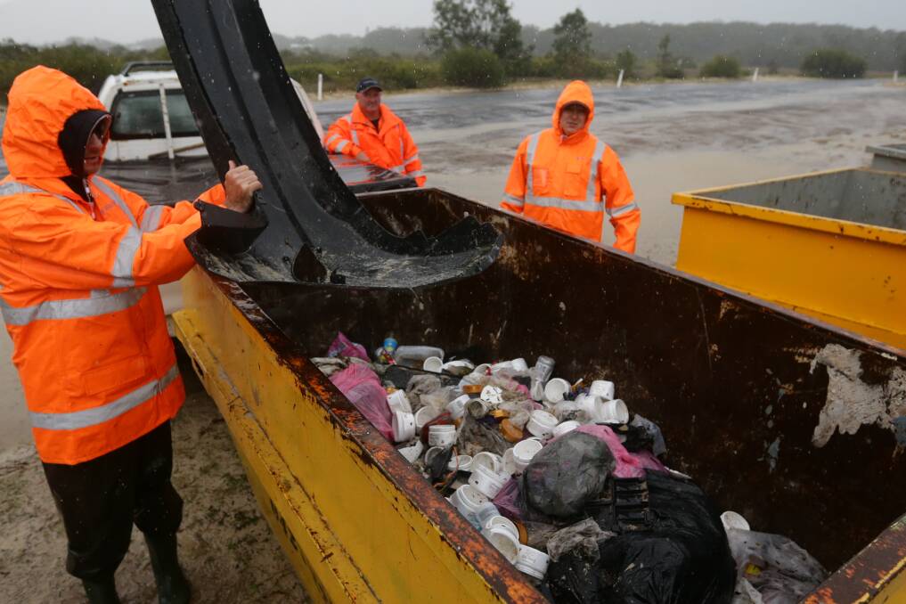 WASH UP: Varley employees at Jimmy's Beach in 2018 cleaning up debris from YM Efficiency's containers . Picture: Jonathan Carroll