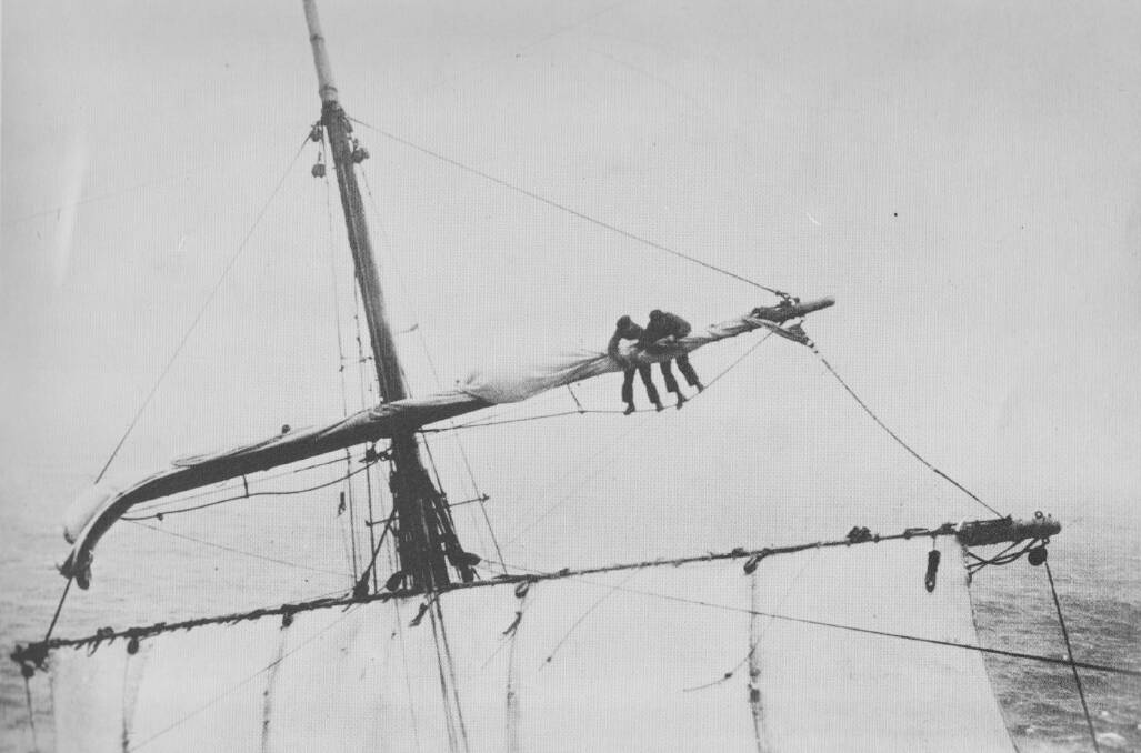 TALL ORDER: Two sailors aboard the Pamir grapple with an unruly sail in a stiff breeze high above the tilting ship's deck. Pictures: Supplied
