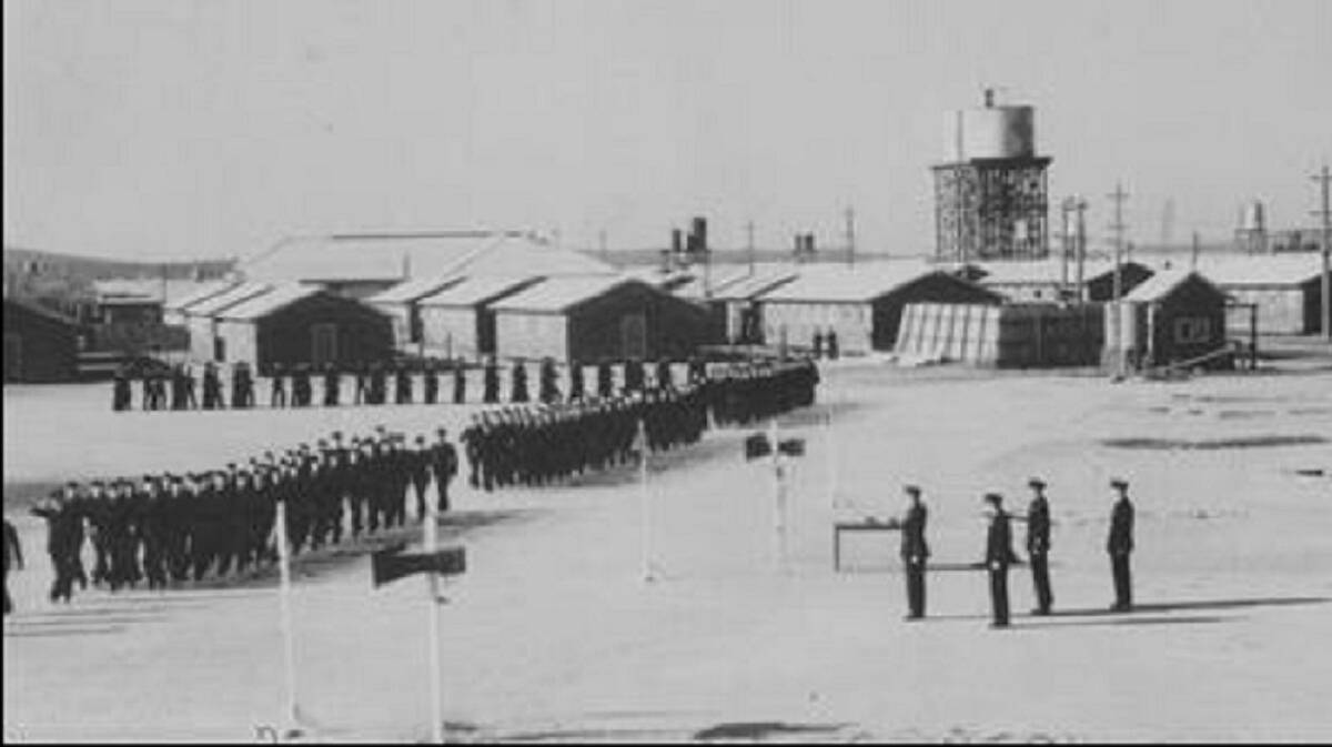 EYES LEFT: RAAF personnel marching on parade ground at a RAAF base somewhere in Australia. Image: University of Newcastle's Cultural Collections 
