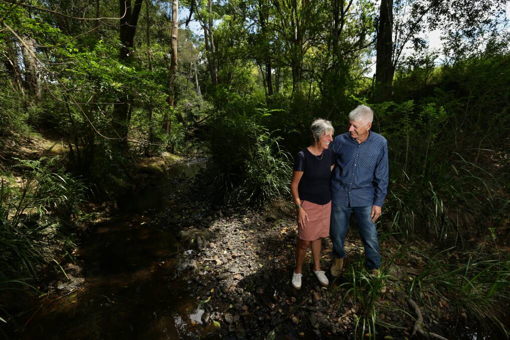 Cheryl and Gordon Moody at the creek that runs through their amazing property.