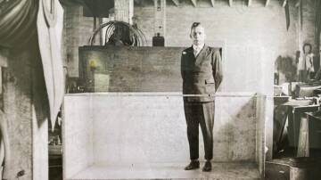 SHAM DUNK: Van Eyk stands in his special bathtub used to publicly baptise converts. Picture: Courtesy Cessnock Library
